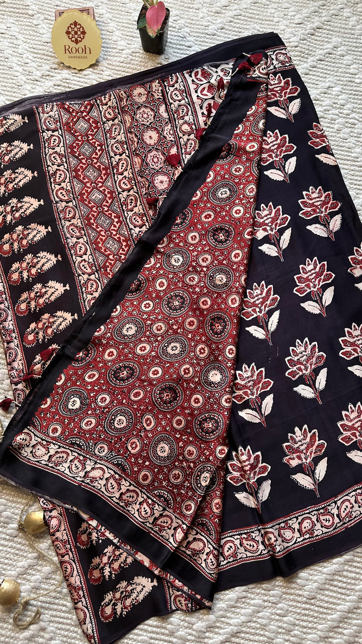 BLOSSOMS ON MIDNIGHT BLACK- SUPER PREMIUM & BUTTERY SOFT AJRAKH HAND BLOCK PRINTED MODAL SILK SAREE