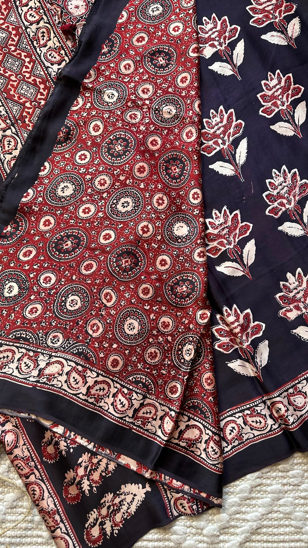 BLOSSOMS ON MIDNIGHT BLACK- SUPER PREMIUM & BUTTERY SOFT AJRAKH HAND BLOCK PRINTED MODAL SILK SAREE
