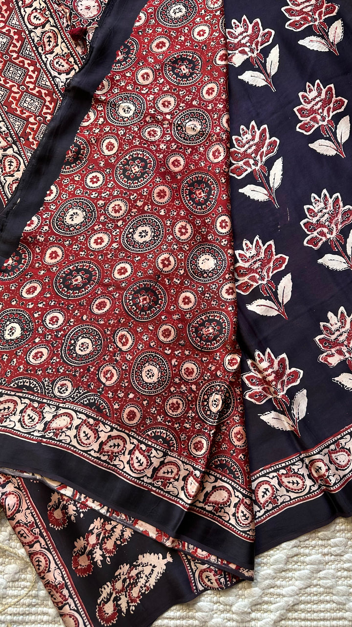 BLOSSOMS ON MIDNIGHT BLACK- SUPER PREMIUM & BUTTERY SOFT AJRAKH HAND BLOCK PRINTED MODAL SILK SAREE