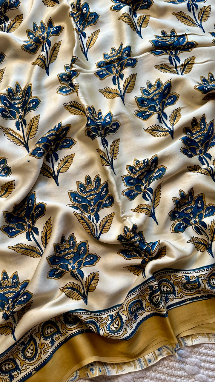 BLOSSOMS ON IVORY- SUPER PREMIUM & BUTTERY SOFT AJRAKH HAND BLOCK PRINTED MODAL SILK SAREE