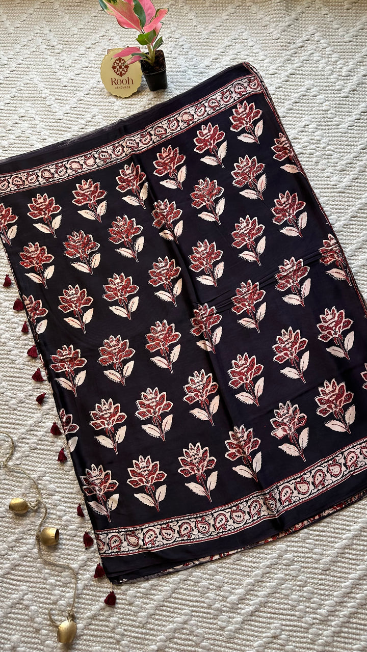 BLOSSOMS ON MIDNIGHT BLACK- SUPER PREMIUM & BUTTERY SOFT AJRAKH HAND BLOCK PRINTED MODAL SILK SAREE