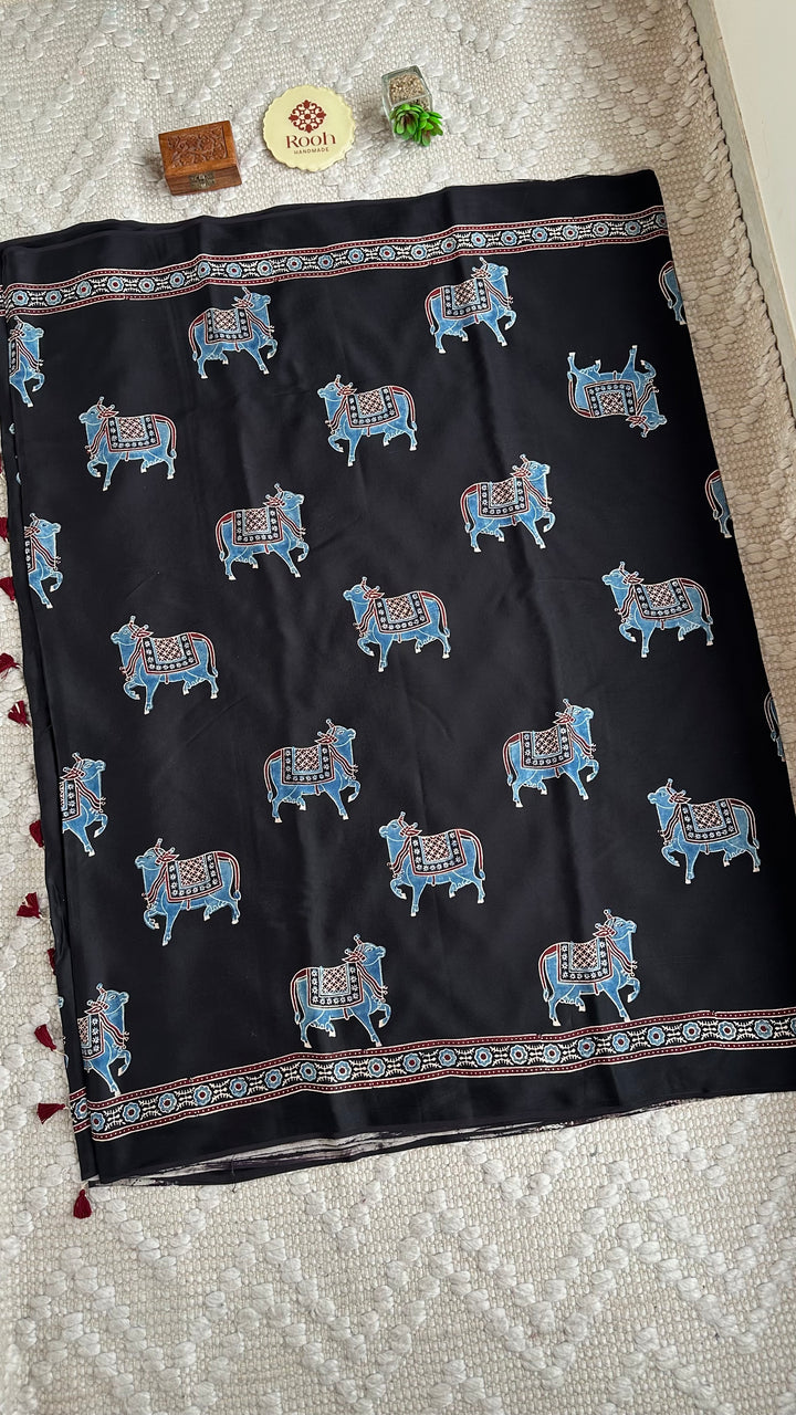 BLUE NANDI PICHWAI - BLACK PREMIUM AJRAKH HAND BLOCK PRINTED MODAL SILK SAREE (ONLY AVAILABLE ON PRE ORDER - DISPATCH TIME IS 30-40 DAYS)