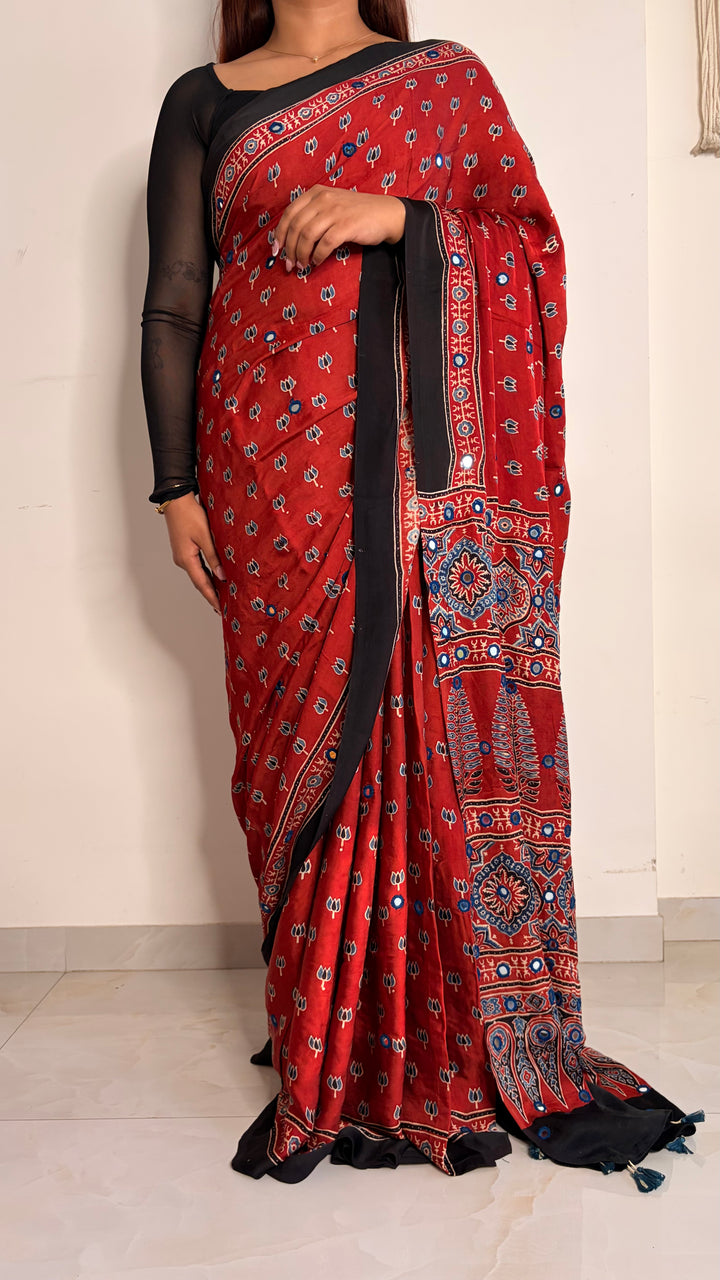 NOOR- AJRAKH MADDER RED HAND BLOCK PRINTED PREMIUM MODAL SILK SAREE WITH MIRROR HAND-EMBROIDERY (ONLY AVAILABLE ON PRE-ORDER - DISPATCH TIME IS 20-25 DAYS)
