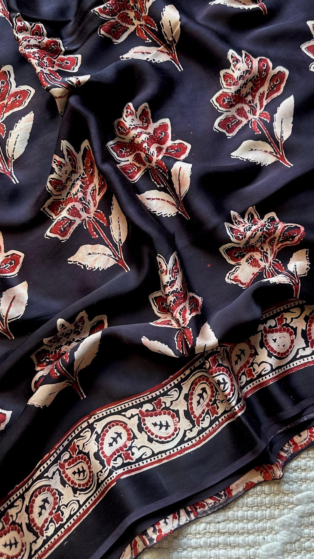 BLOSSOMS ON MIDNIGHT BLACK- SUPER PREMIUM & BUTTERY SOFT AJRAKH HAND BLOCK PRINTED MODAL SILK SAREE