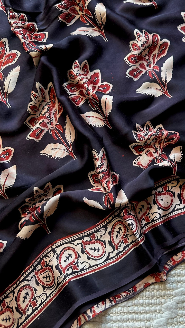 BLOSSOMS ON MIDNIGHT BLACK- SUPER PREMIUM & BUTTERY SOFT AJRAKH HAND BLOCK PRINTED MODAL SILK SAREE
