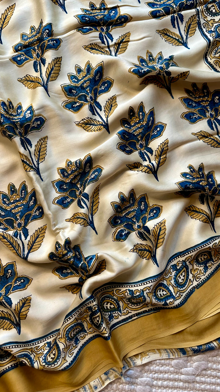 BLOSSOMS ON IVORY- SUPER PREMIUM & BUTTERY SOFT AJRAKH HAND BLOCK PRINTED MODAL SILK SAREE