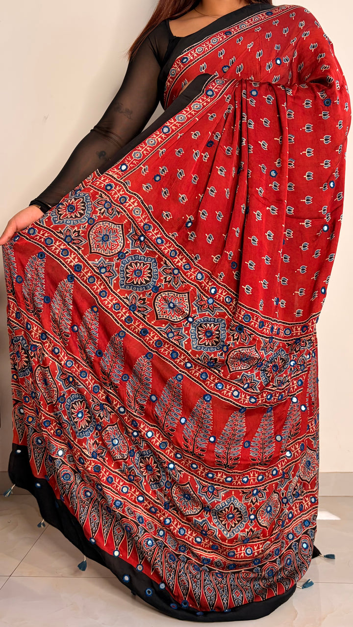 NOOR- AJRAKH MADDER RED HAND BLOCK PRINTED PREMIUM MODAL SILK SAREE WITH MIRROR HAND-EMBROIDERY (ONLY AVAILABLE ON PRE-ORDER - DISPATCH TIME IS 20-25 DAYS)