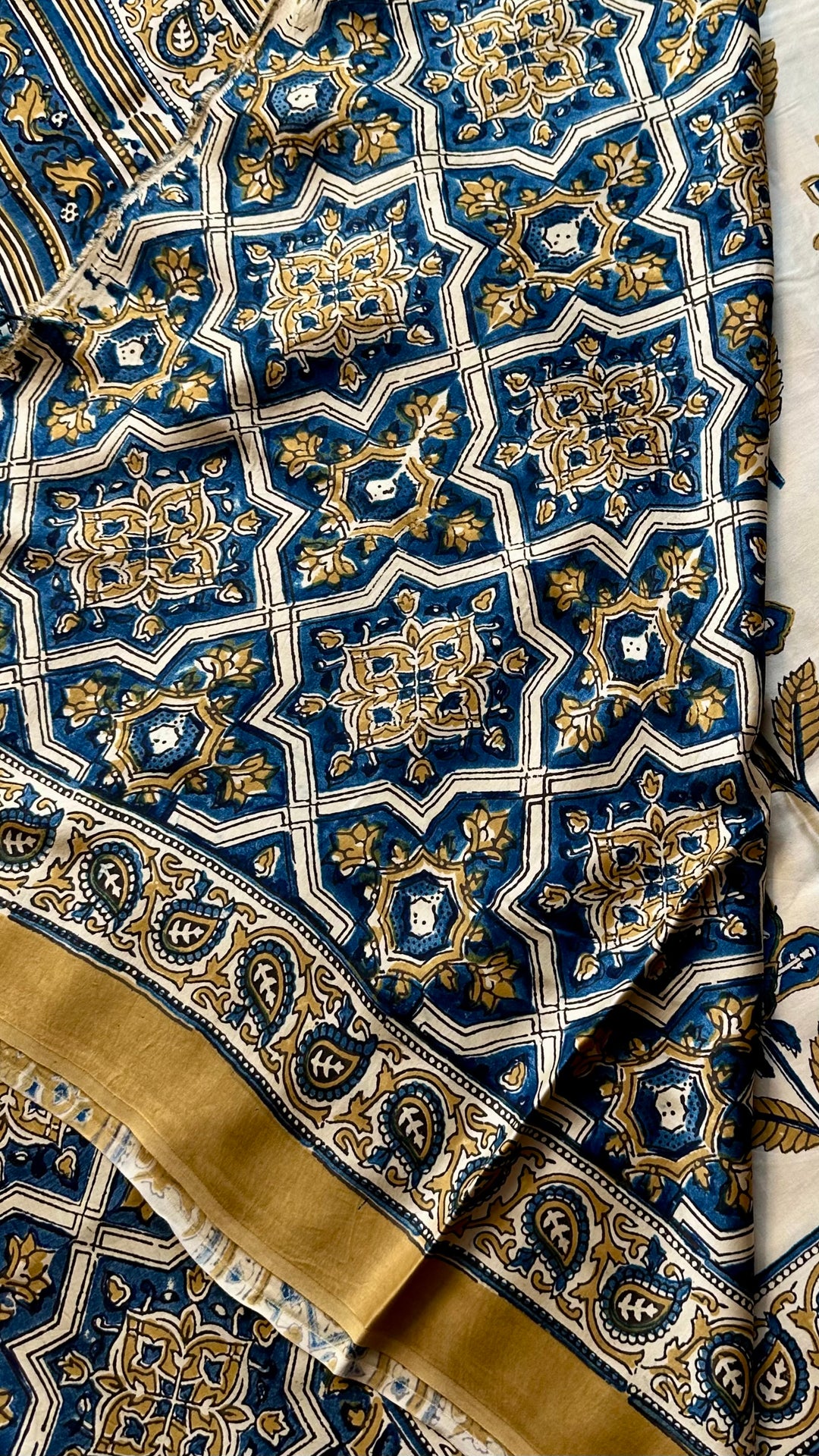 BLOSSOMS ON IVORY- SUPER PREMIUM & BUTTERY SOFT AJRAKH HAND BLOCK PRINTED MODAL SILK SAREE