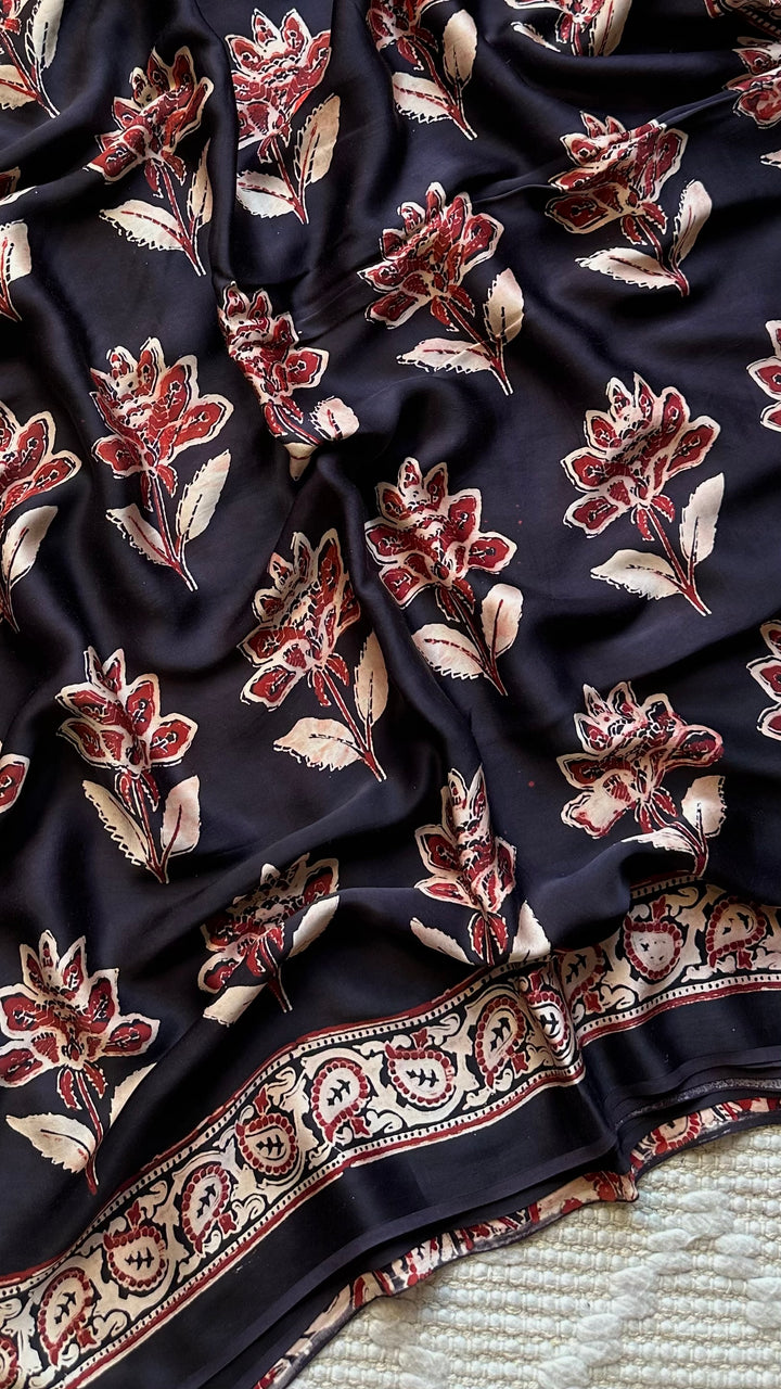 BLOSSOMS ON MIDNIGHT BLACK- SUPER PREMIUM & BUTTERY SOFT AJRAKH HAND BLOCK PRINTED MODAL SILK SAREE