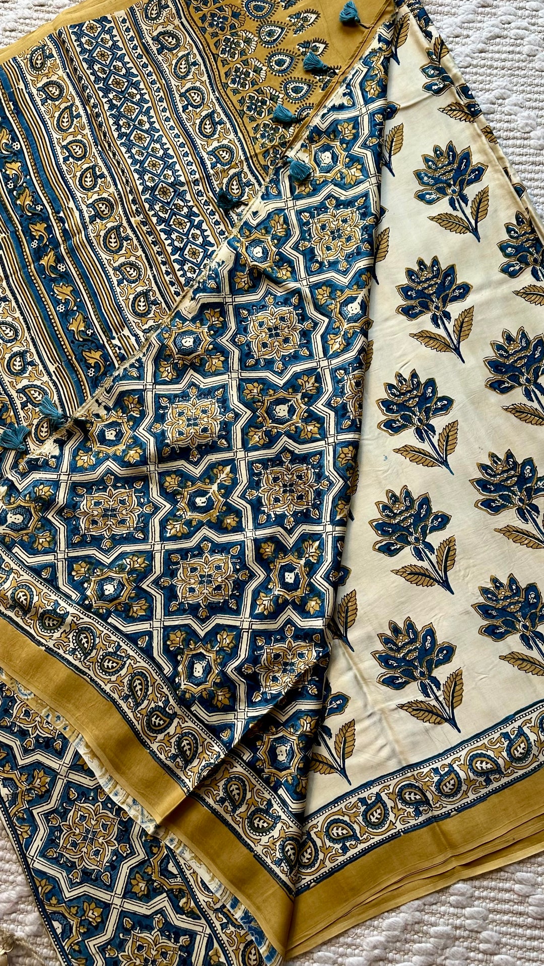 BLOSSOMS ON IVORY- SUPER PREMIUM & BUTTERY SOFT AJRAKH HAND BLOCK PRINTED MODAL SILK SAREE