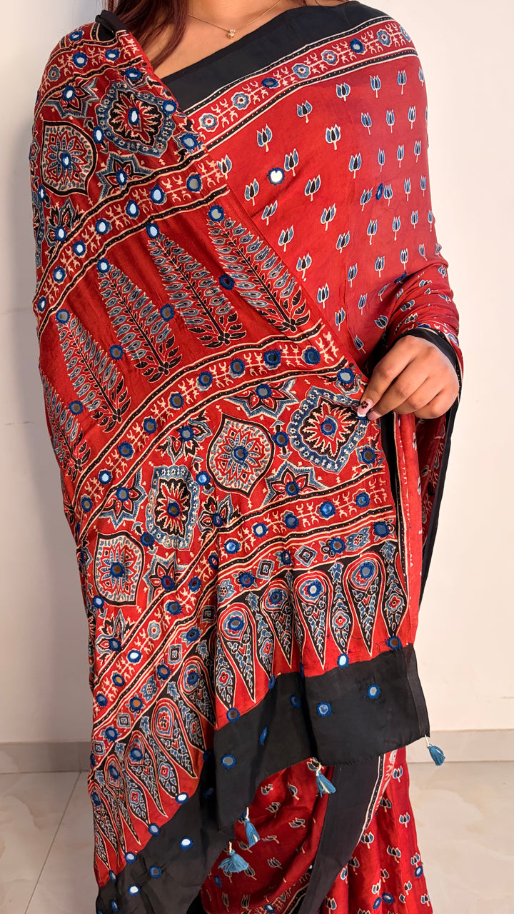 NOOR- AJRAKH MADDER RED HAND BLOCK PRINTED PREMIUM MODAL SILK SAREE WITH MIRROR HAND-EMBROIDERY (ONLY AVAILABLE ON PRE-ORDER - DISPATCH TIME IS 20-25 DAYS)