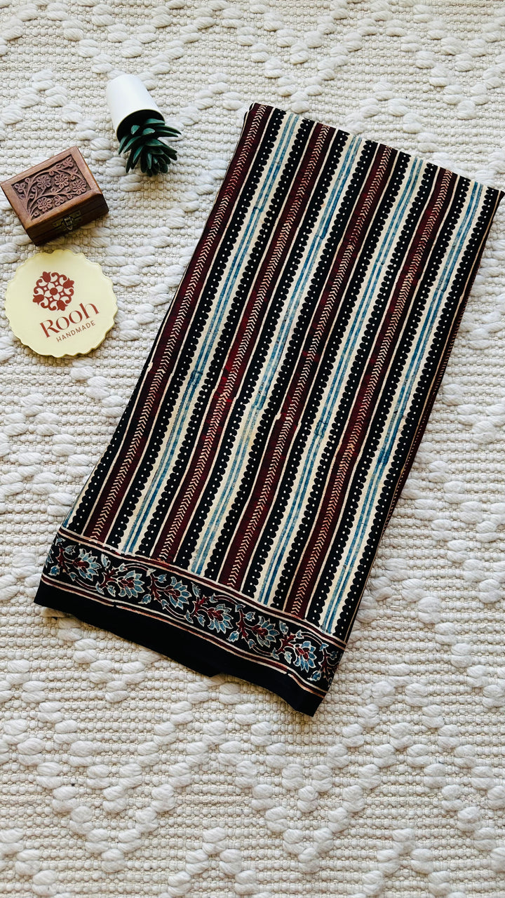 VRITIKA- BLACK STRIPED AJRAKH HAND BLOCK PRINTED PREMIUM MODAL SILK SAREE (ONLY AVAILABLE ON PRE ORDER- DISPATCH TIME IS 45-50 DAYS)