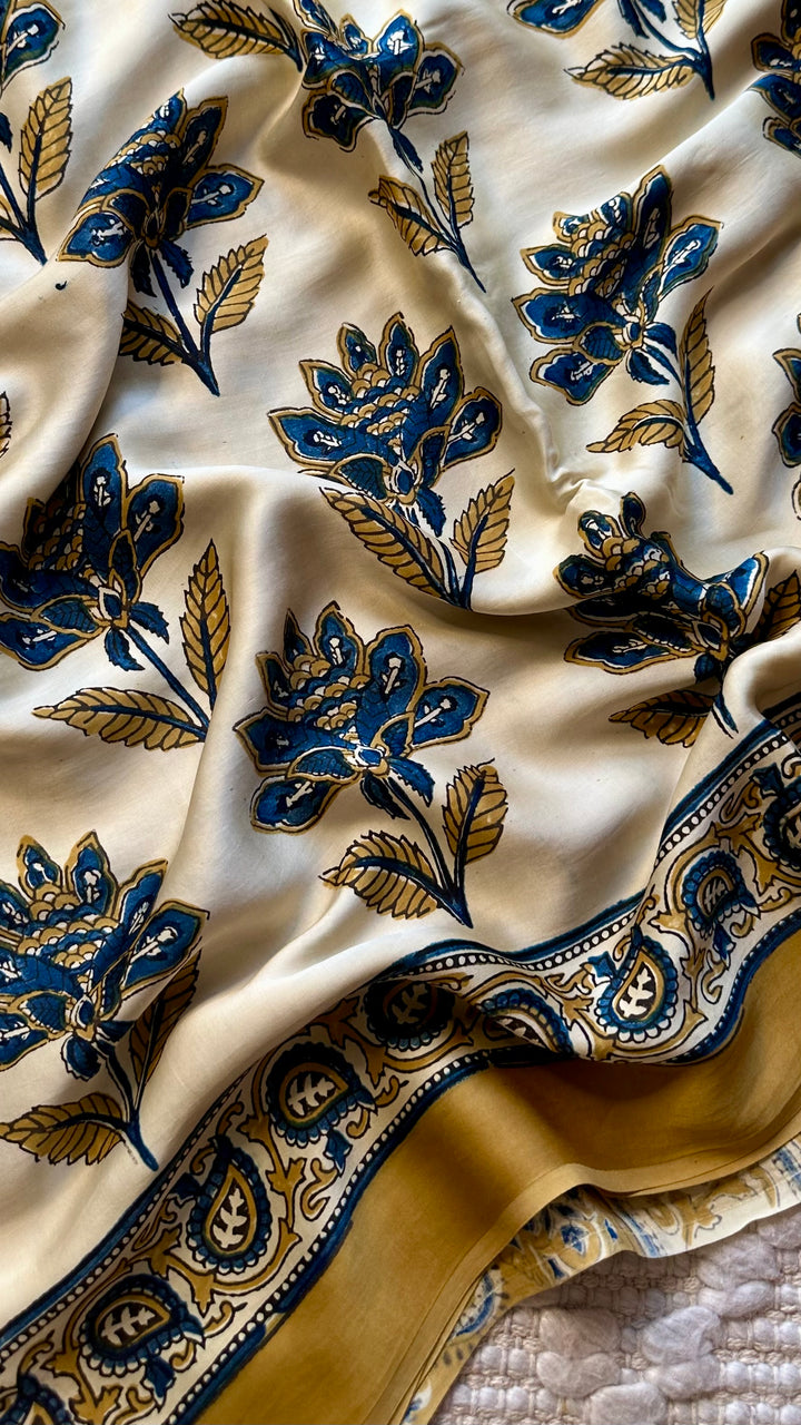 BLOSSOMS ON IVORY- SUPER PREMIUM & BUTTERY SOFT AJRAKH HAND BLOCK PRINTED MODAL SILK SAREE