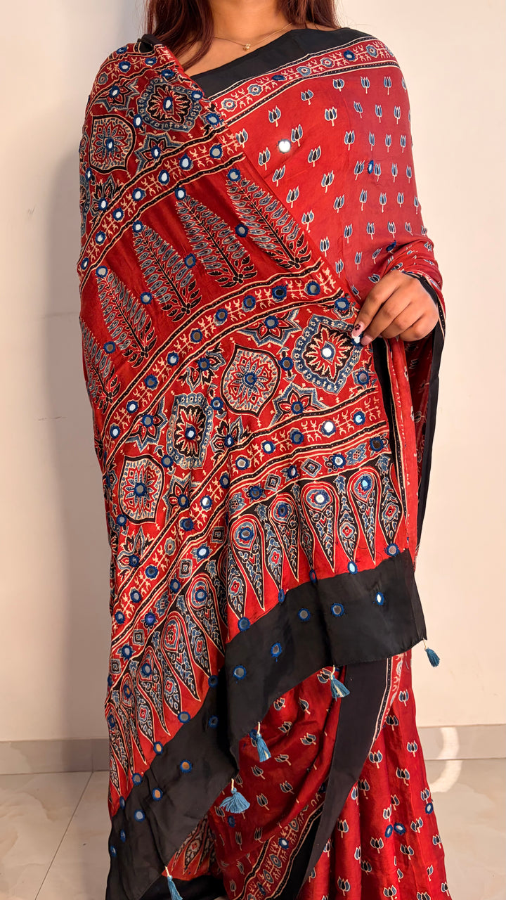 NOOR- AJRAKH MADDER RED HAND BLOCK PRINTED PREMIUM MODAL SILK SAREE WITH MIRROR HAND-EMBROIDERY (ONLY AVAILABLE ON PRE-ORDER - DISPATCH TIME IS 20-25 DAYS)