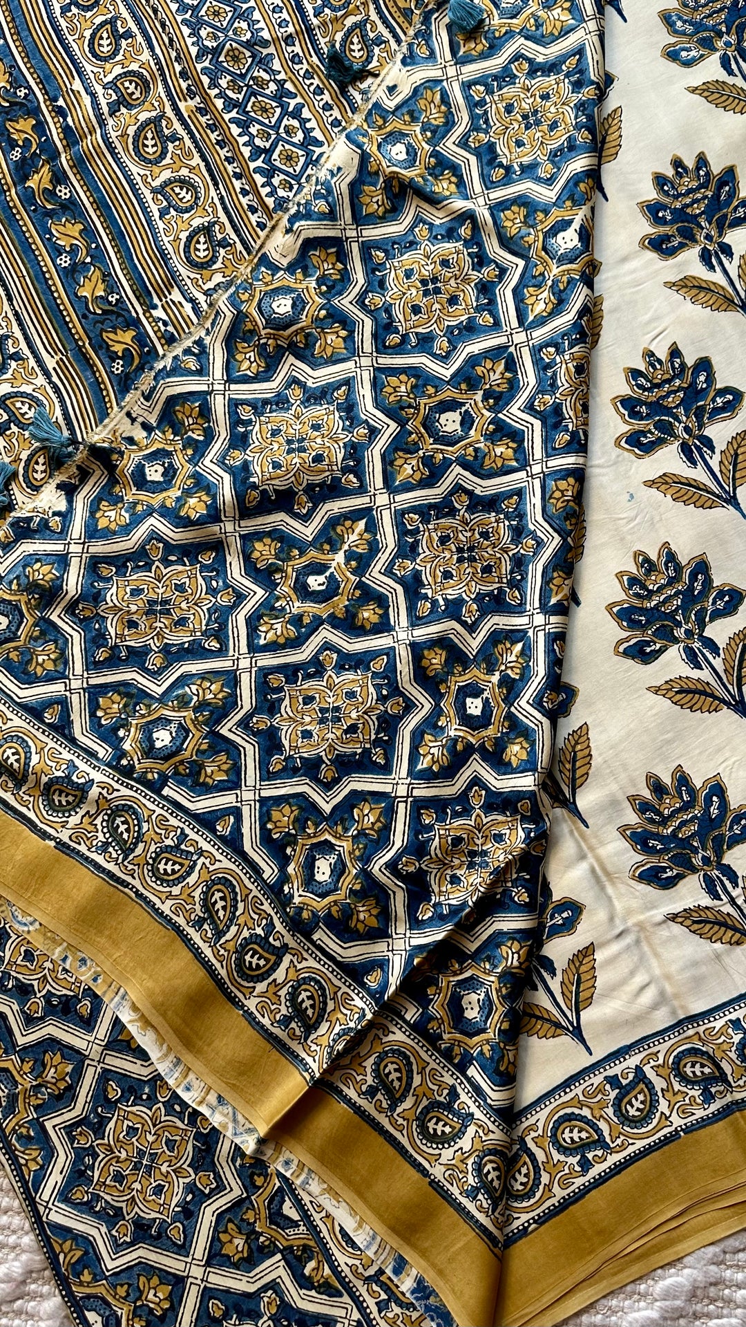 BLOSSOMS ON IVORY- SUPER PREMIUM & BUTTERY SOFT AJRAKH HAND BLOCK PRINTED MODAL SILK SAREE