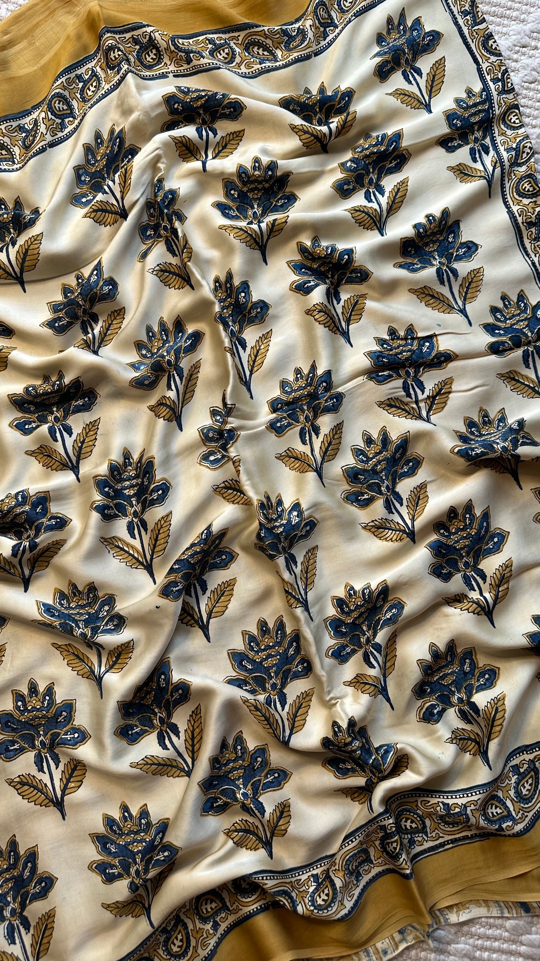 BLOSSOMS ON IVORY- SUPER PREMIUM & BUTTERY SOFT AJRAKH HAND BLOCK PRINTED MODAL SILK SAREE